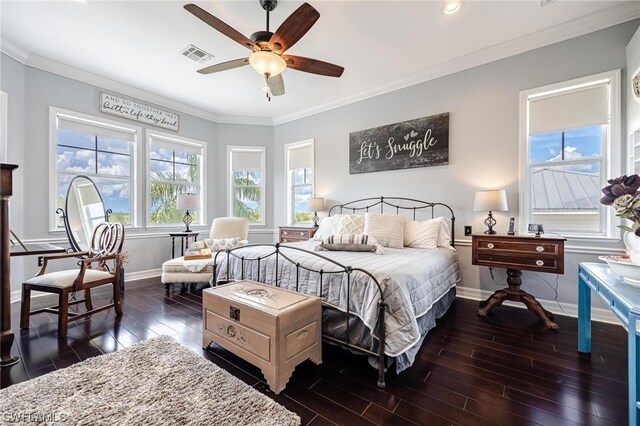 bedroom with crown molding, dark hardwood / wood-style flooring, ceiling fan, and multiple windows