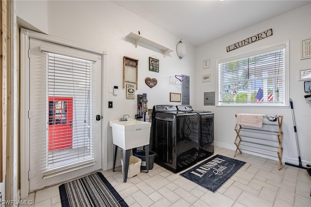 washroom featuring separate washer and dryer and light tile flooring