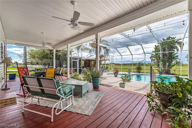 sunroom / solarium with ceiling fan and a wealth of natural light