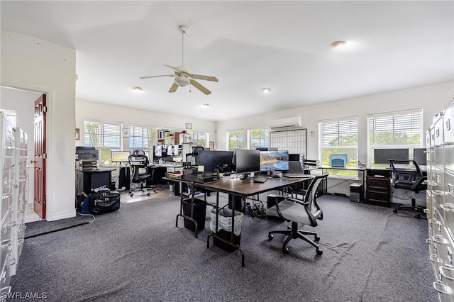 carpeted home office featuring lofted ceiling, a healthy amount of sunlight, and ceiling fan