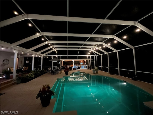 view of pool at night