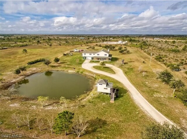 aerial view featuring a rural view and a water view