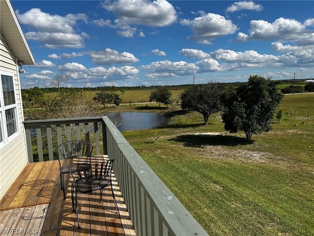 balcony with a water view and a rural view