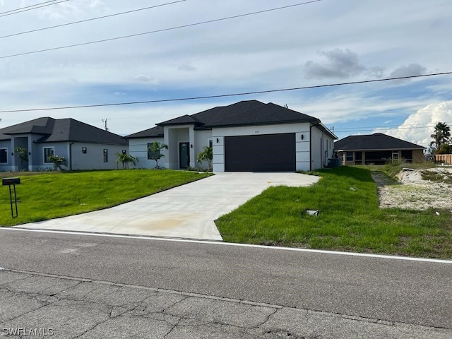 view of front of house with a front lawn and a garage