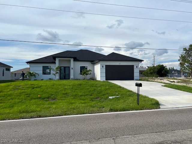 view of front facade with a front lawn and a garage