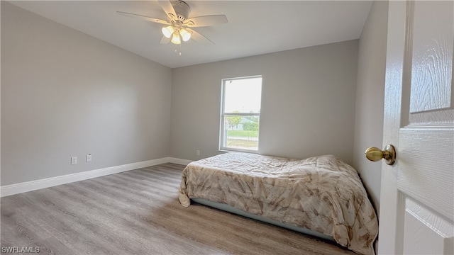 bedroom featuring ceiling fan and light hardwood / wood-style floors