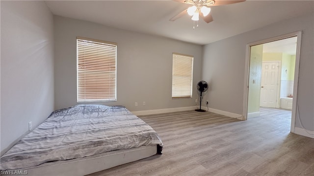 bedroom featuring light hardwood / wood-style flooring and ceiling fan