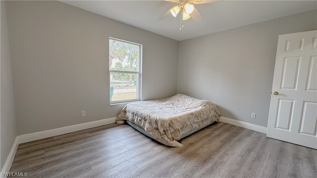 bedroom featuring ceiling fan and hardwood / wood-style flooring