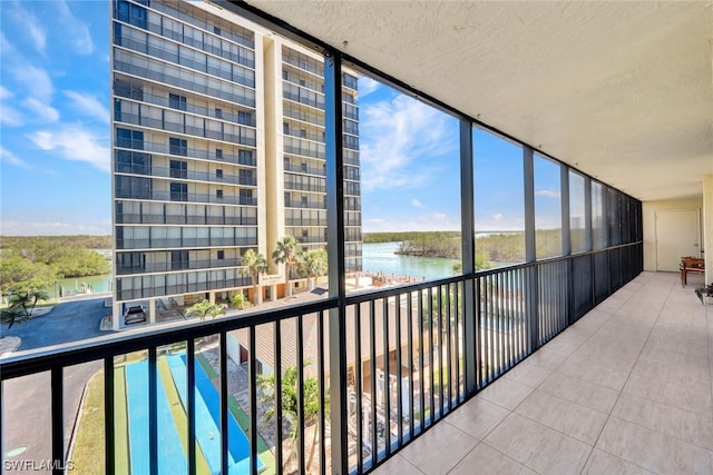 balcony featuring a water view