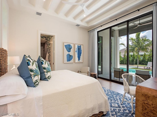 bedroom with french doors, access to outside, ceiling fan, and hardwood / wood-style flooring