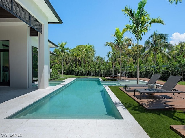 view of swimming pool with a patio area