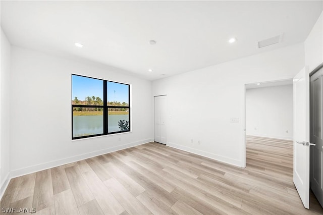 empty room featuring light hardwood / wood-style floors