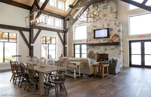 dining area featuring high vaulted ceiling, french doors, beam ceiling, hardwood / wood-style flooring, and a notable chandelier