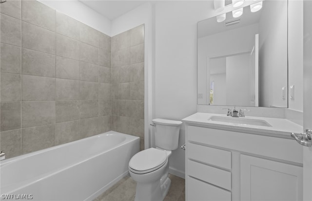 full bathroom with large vanity, tile floors, toilet, and tiled shower / bath