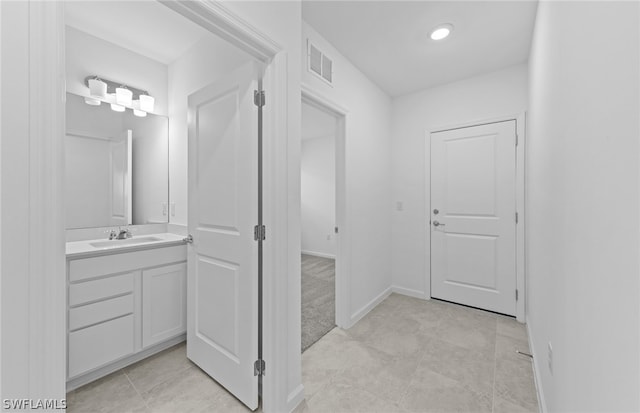 bathroom featuring vanity and tile flooring