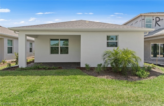 view of side of home with a lawn