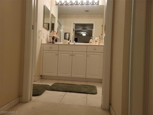 bathroom featuring tile flooring, oversized vanity, and ceiling fan