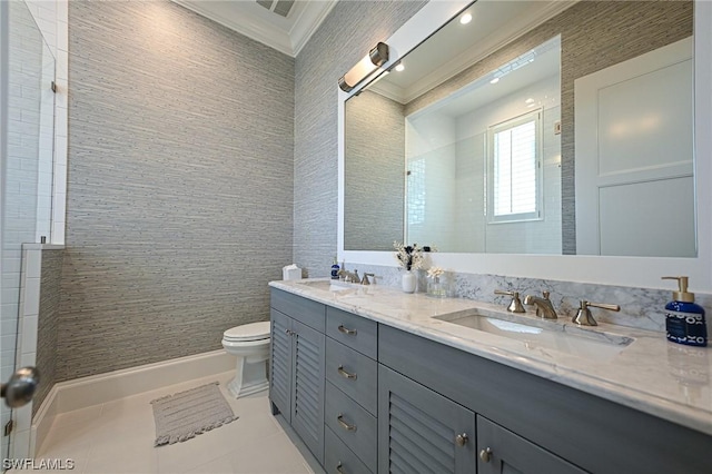 bathroom with tile walls, vanity, toilet, crown molding, and tile patterned floors