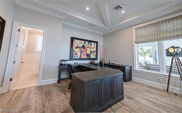 office area with ornamental molding, a healthy amount of sunlight, and light hardwood / wood-style flooring