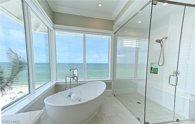 bathroom featuring plus walk in shower, a water view, a wealth of natural light, and crown molding