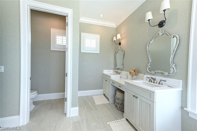 bathroom featuring ornamental molding, vanity, and toilet