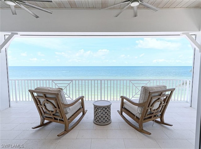 exterior space featuring a water view, ceiling fan, and a patio area