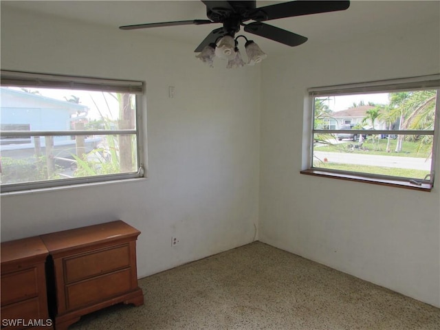 unfurnished room featuring ceiling fan