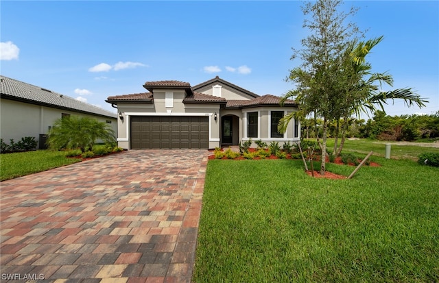 mediterranean / spanish house featuring a front lawn and a garage