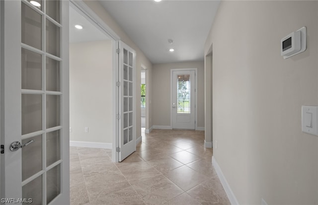 tiled foyer featuring french doors