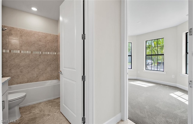 bathroom featuring vanity, tile floors, and toilet