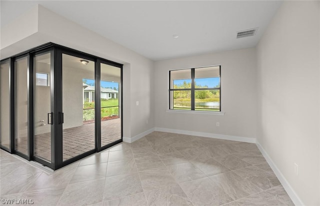 empty room featuring a wealth of natural light