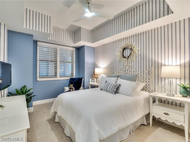 bedroom with ceiling fan and light carpet