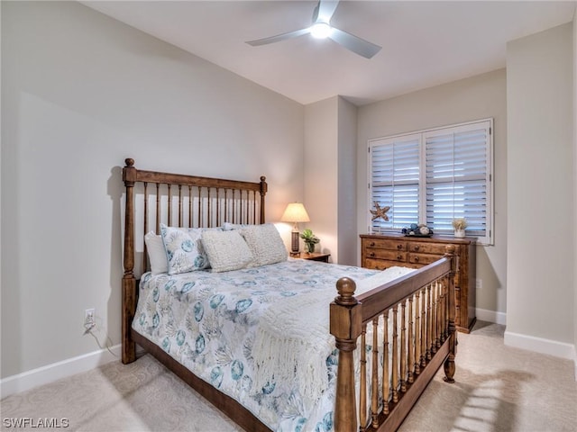 bedroom with ceiling fan and light carpet