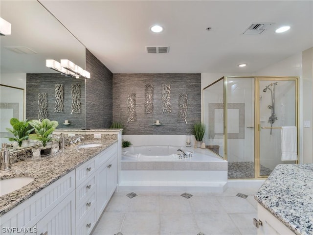 bathroom with tile patterned flooring, plus walk in shower, and vanity