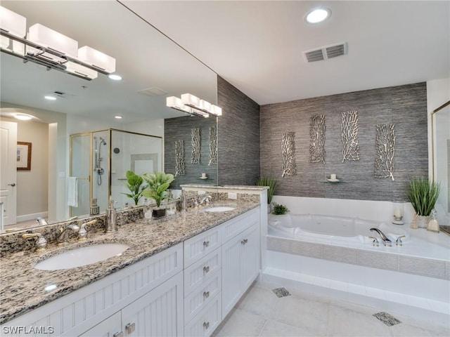 bathroom featuring tile patterned floors, shower with separate bathtub, and vanity