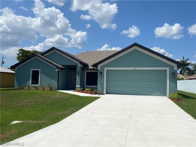 single story home featuring a garage and a front yard