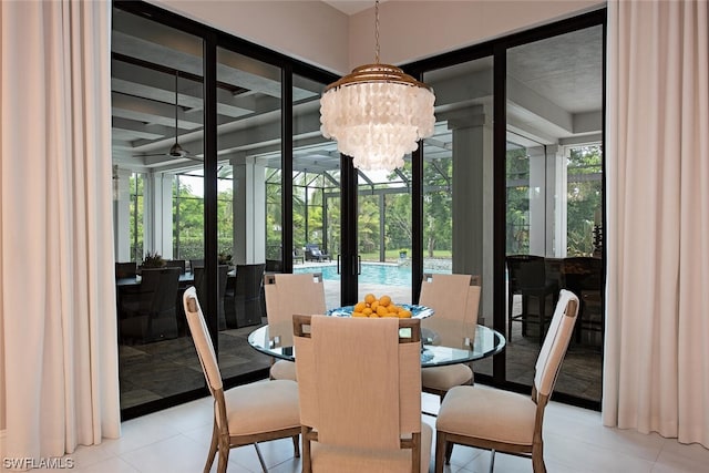 dining area with plenty of natural light, tile patterned floors, and a notable chandelier