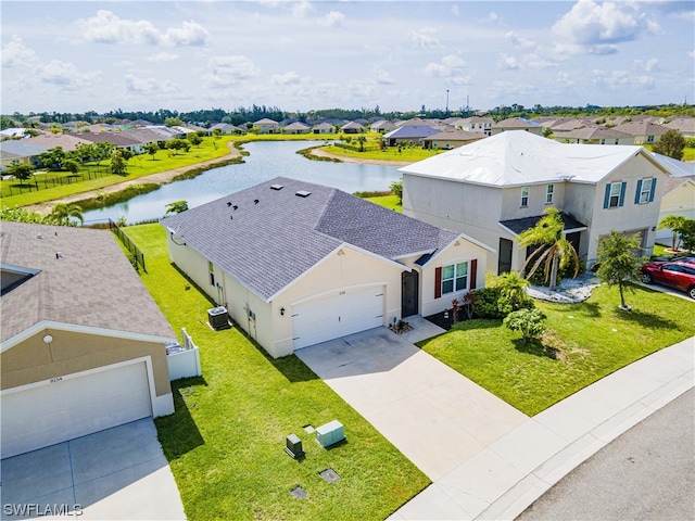 birds eye view of property with a water view