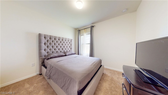 bedroom with light colored carpet