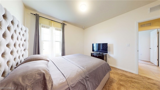 bedroom with light tile floors