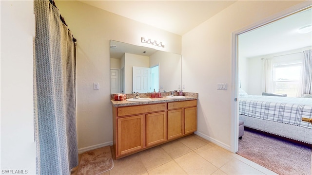 bathroom with tile floors and dual bowl vanity