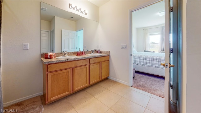 bathroom featuring double sink, tile floors, and large vanity