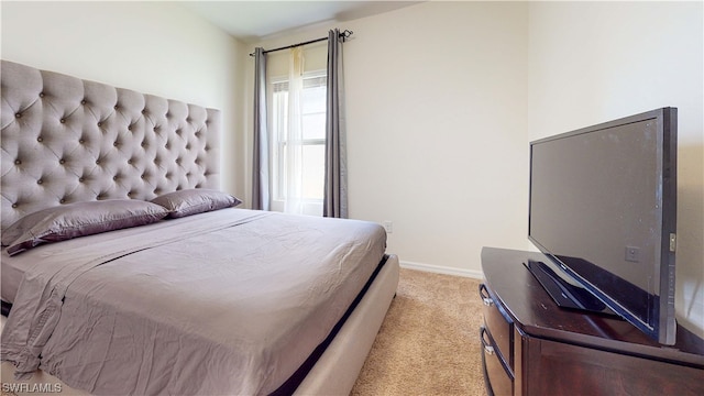 bedroom featuring light colored carpet