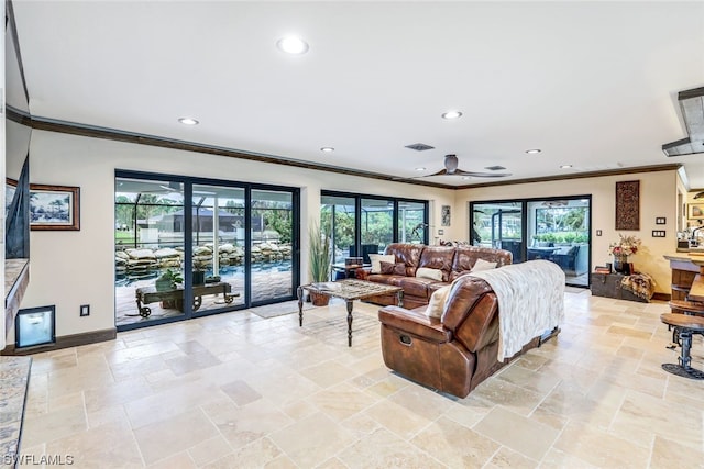 living room with crown molding and ceiling fan