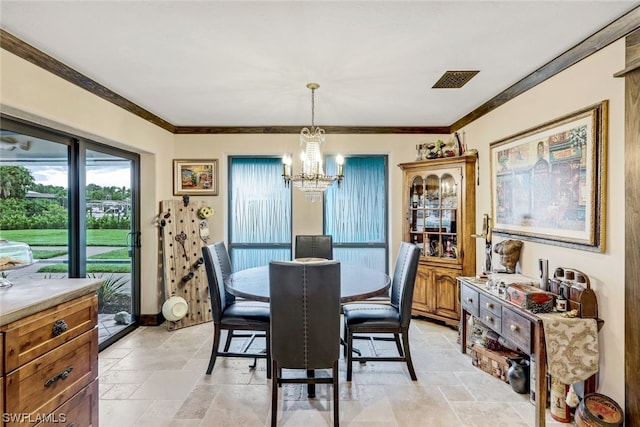 dining space featuring a notable chandelier and crown molding