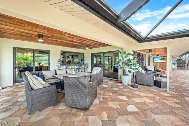 view of patio featuring an outdoor living space and ceiling fan