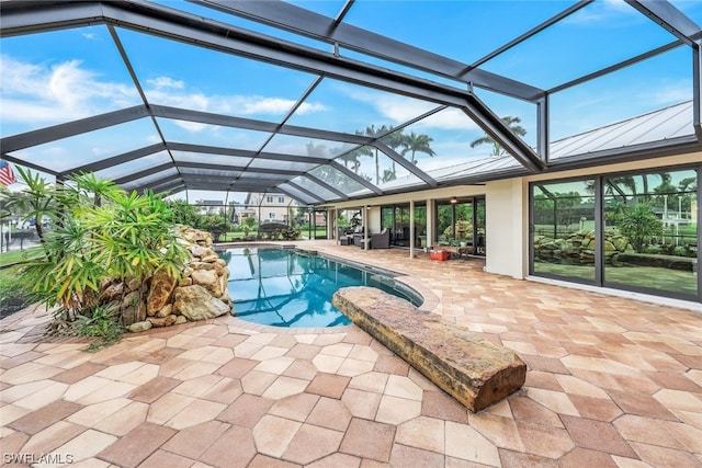 view of pool featuring a lanai and a patio area