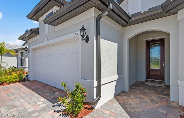 doorway to property featuring a garage