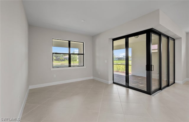 spare room featuring light tile flooring