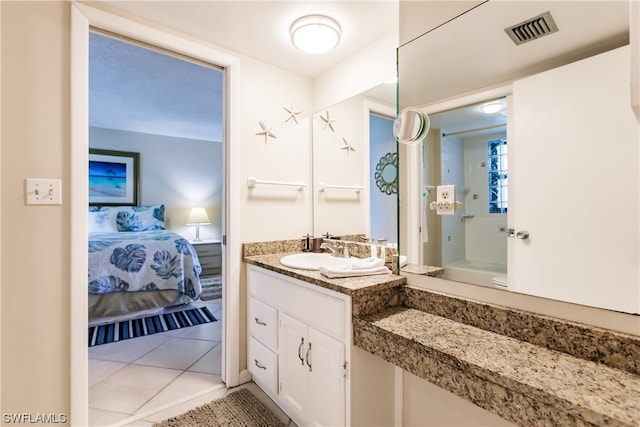 bathroom with tile flooring and oversized vanity